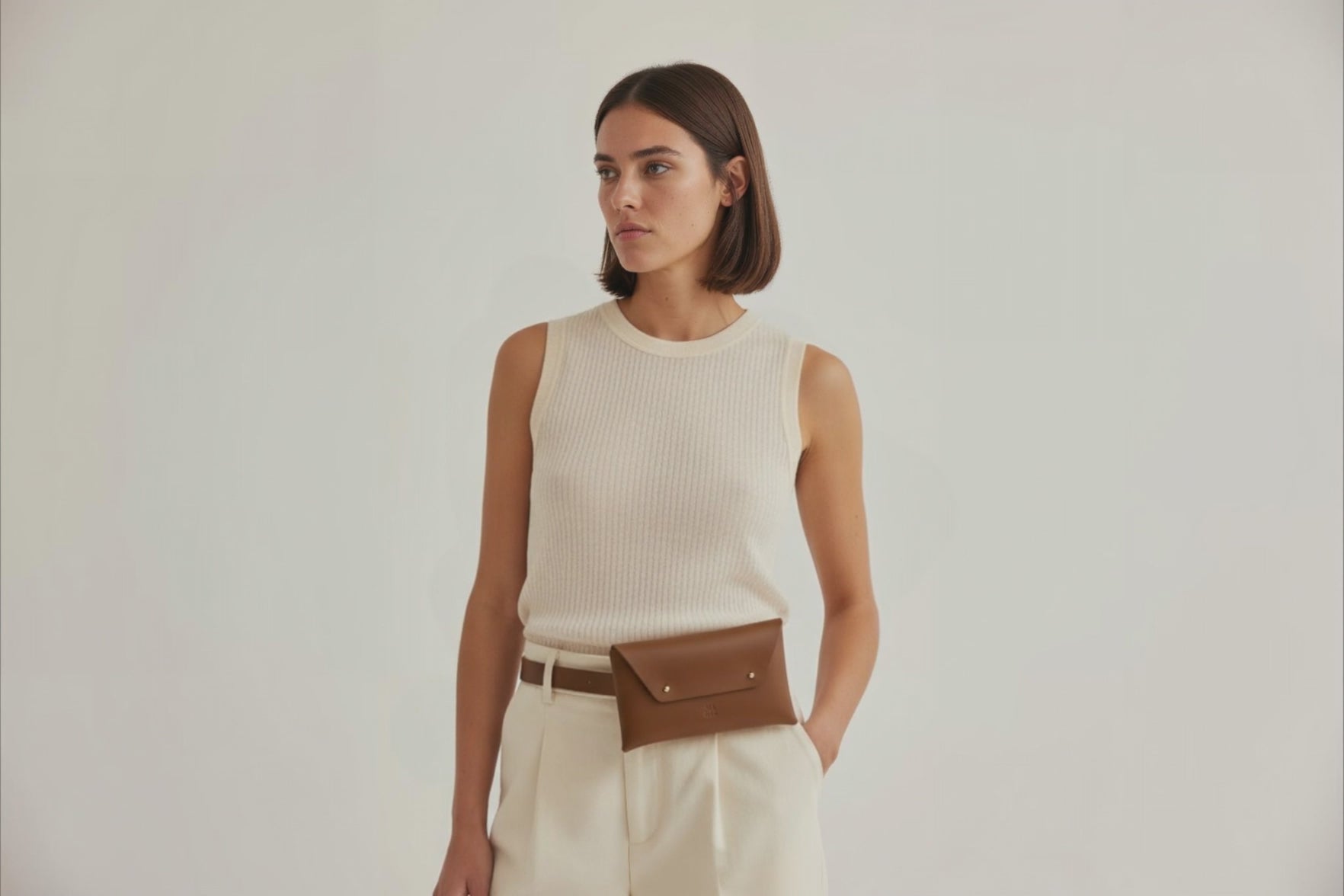 Belt Bag Leather Dark Brown Color On A Woman Model Fanny Pack Waist Bag Vegetable Tanned Leather Full Grain Premium Quality Modern Minimalist Design Atelier Madre Manuel Dreesmann Barcelona Spain