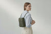 Woven Backpack Medium Olive Green Leather On Model Minimalistic Design Atelier Madre Manuel Dreesmann Barcelona