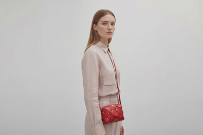Rivet Bag Small Leather Red Color Clutch Crossbody On Model Video Loop Walk Shoulder Detachable Full Brass Vegetable Tanned Full Grain Leather High Quality Modern Minimalistic Design Atelier Madre Manuel Dreesmann Barcelona Spain