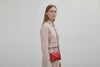 Rivet Bag Small Leather Red Color Clutch Crossbody On Model Video Loop Walk Shoulder Detachable Full Brass Vegetable Tanned Full Grain Leather High Quality Modern Minimalistic Design Atelier Madre Manuel Dreesmann Barcelona Spain