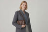 Woven Leather Bag Saka Bag Dark Brown Color Leather On Woman Model Bright Background Vegetable Tanned Leather Modern Minimalist Design Premium Quality Atelier Madre Manuel Dreesmann Barcelona Spain Video Loop