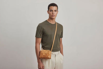 Rivet Bag Small Leather Brown Color Clutch On Model Video Loop Walk Crossbody Shoulder Detachable Full Brass Vegetable Tanned Full Grain Leather High Quality Modern Minimalistic Design Atelier Madre Manuel Dreesmann Barcelona Spain