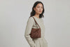 Leather Bag Dark Brown Color Big Saka On A Woman Model Loop Video Braided  Vegetable Tanned Leather Modern Minimalist Design Premium Quality Atelier Madre Manuel Dreesmann Barcelona Spain