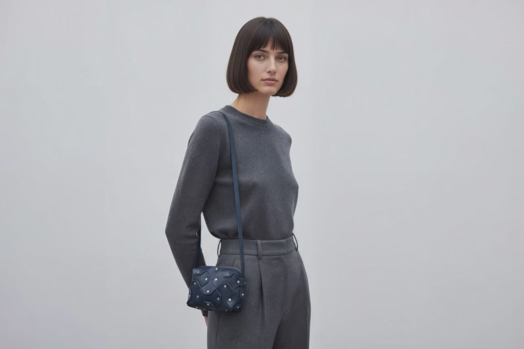 Rivet Bag Small Leather Marine Blue Color Clutch On Model Video Loop Walk Crossbody Shoulder Detachable Full Brass Vegetable Tanned Full Grain Leather High Quality Modern Minimalistic Design Atelier Madre Manuel Dreesmann Barcelona Spain