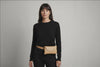 Belt Bag Leather Natural Color On A Woman Model Fanny Pack Waist Bag Vegetable Tanned Leather Full Grain Premium Quality Modern Minimalist Design Atelier Madre Manuel Dreesmann Barcelona Spain