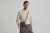 Rivet Bag Small Leather Olive Green Color Clutch Olive Green On Model Video Loop Walk Crossbody Shoulder Detachable Full Brass Vegetable Tanned Full Grain Leather High Quality Modern Minimalistic Design Atelier Madre Manuel Dreesmann Barcelona Spain