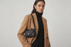 Brick Bag Black Color Leather On Model Bright Background Vegetable Tanned Leather Loop Video Modern Minimalist Design Premium Quality Atelier Madre Manuel Dreesmann Barcelona Spain