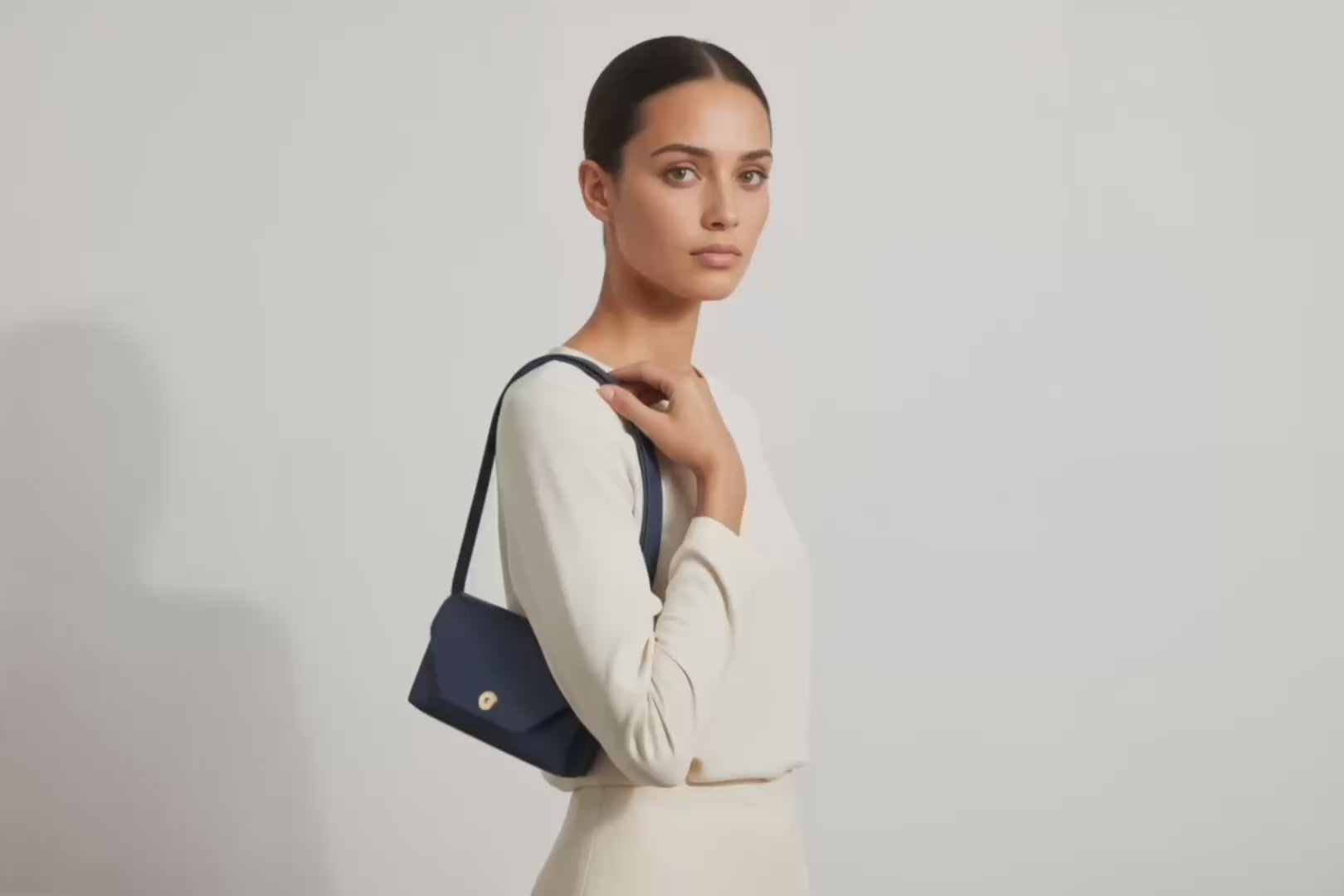 Brick Bag Marine Blue Color Leather On Model Bright Background Vegetable Tanned Leather Loop Video Modern Minimalist Design Premium Quality Atelier Madre Manuel Dreesmann Barcelona Spain