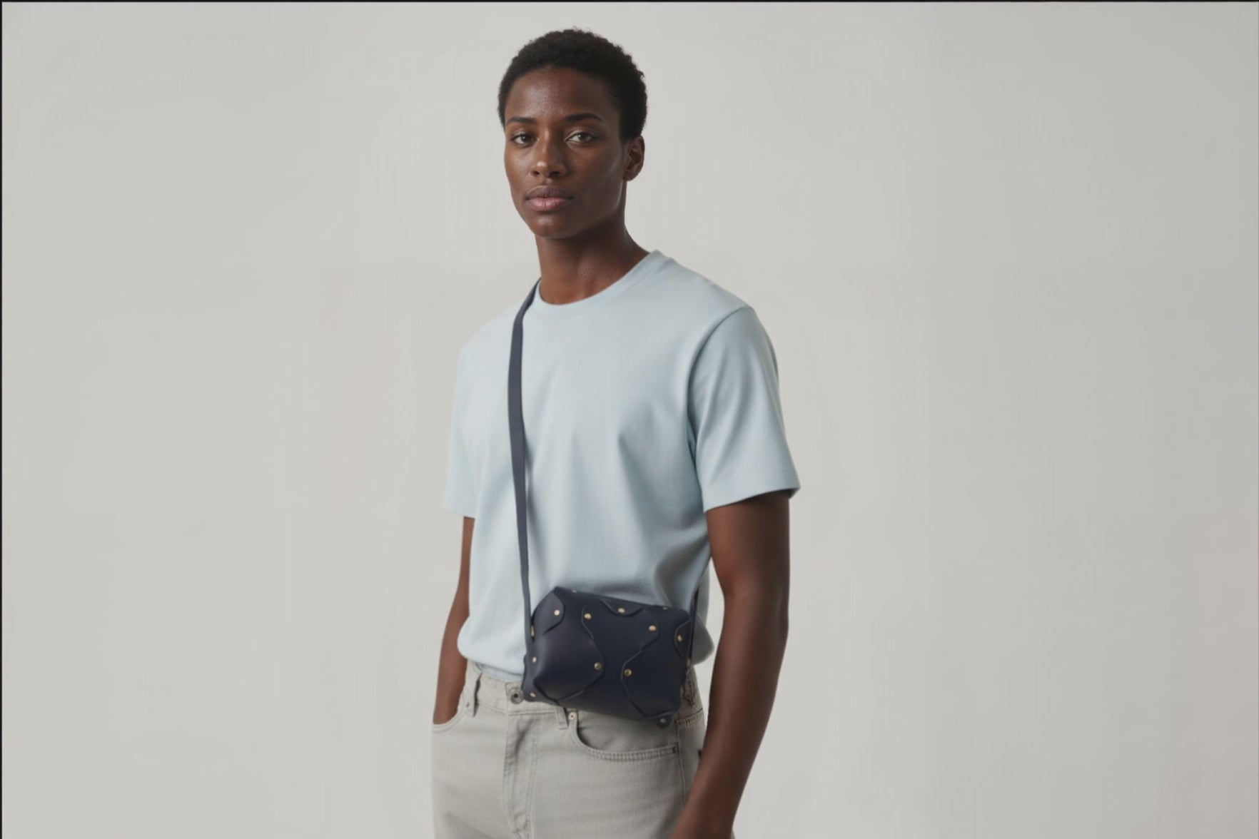 Marlin Leather Bag Small Marine Blue Color On A Man Model Premium Quality Minimalist Design Atelier Madre Manuel Dreesmann Barcelona Spain