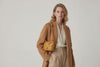 Woven Leather Bag Saka Bag Brown Color Leather On Woman Model Bright Background Vegetable Tanned Leather Modern Minimalist Design Premium Quality Atelier Madre Manuel Dreesmann Barcelona Spain Video Loop