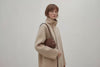 Fiona Bag Dark Brown Color Leather On Model Bright Background Vegetable Tanned Leather Video Loop Walking Modern Minimalist Design Premium Quality Atelier Madre Manuel Dreesmann Barcelona Spain
